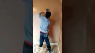 Plastering Flattening wall with refina spatula