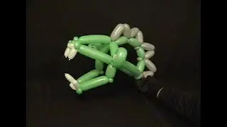 Learn how to make a balloon animal dragon hat using balloon twisting