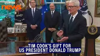 Apple CEO Tim Cook presents Donald Trump with a glass sculpture on 24k gold base