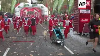 Thousands Dressed as Santa Claus Run for Charity