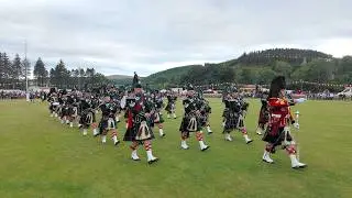 Lonach Pipe Band march out ending 2025 Lonach Gathering Highland Games Beating Retreat in Scotland