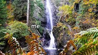 Wild swimming in a roaring waterfall in the Scottish Highlands