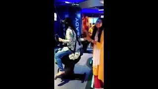 The girl is sitting on a vibrating toy and shaking