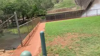 Tinaroo Dam wall and flowing water from the Dam.