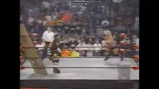 Goldberg spears Rocco Rock through table