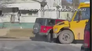 VIDEO: Stolen Jeep crashes into school bus