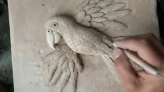 Clay animal making: a clay parrot mural art