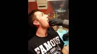 Nik getting his tongue pierced