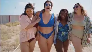 Beautiful plus size women having fun at the beach in the summertime.
