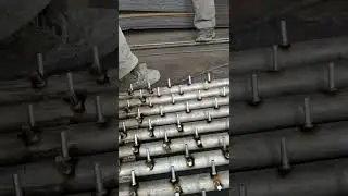Arc gas stud welding on steel pipes.
