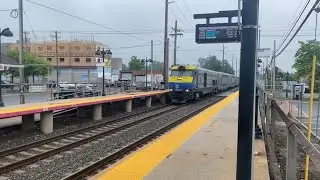 Train 6008 and 6001 at Bay Shore, an M7 train, and passing the Saxon Avenue railroad crossing.