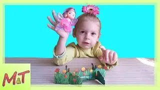 Цветочная фея в маленьких ручках Дашеньки летает в волшебном саду
