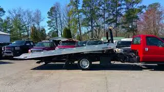 2015 Ford F-550 rollback with a century bed.