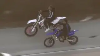 2 dirt bike riders go wrong way on road mid-police chase