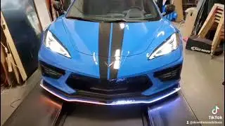 C8 corvette chassis mounted splitter lit in Flo-Motion with integrated turn signals