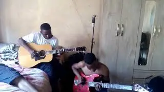 Jikelele khumalo playing his guitar  with Sbu