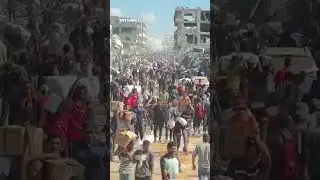 Aid trucks enter Gaza under ceasefire as Palestinians rush to receive supplies