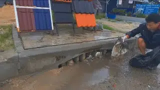 Volunteering to clean up that Clogged culvert drain by Garbage after rain