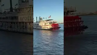 Paddlewheel boat heads down Mississippi River in New Orleans next to French Quarter dock #neworleans