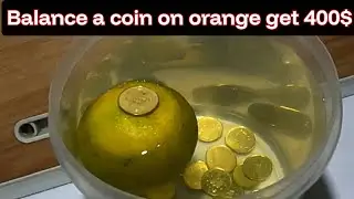 Balance a coin on Orange challenge