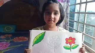 মুনতাহা সুন্দর করে ফুল আঁকছে। 