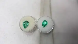 Carbon spots vs clean clarity in natural Colombian emeralds
