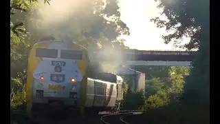 Heavy smoking VIA RAIL train leaving Woodstock ON train station