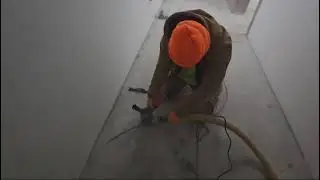 How do I use a grinder to cut open cracks in my concrete?