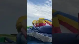 Bouncing on deflating inflatable bounce house slide
