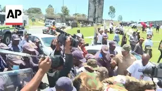 Police clash with protesters in Soweto, near the G20 summit venue