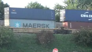 CSX Q022 Train Roars by on Elevated Tracks