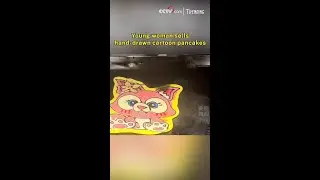 Young woman sells hand-drawn cartoon pancakes