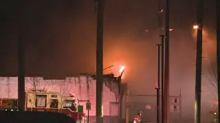 Firefighters battle industrial building fire in Grand Rapids