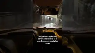 Une grosse vague vient percuter la voiture et le conducteur ne peut plus rouler