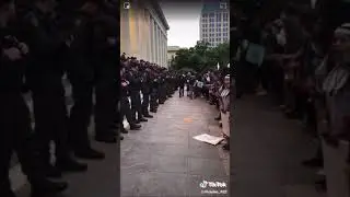 Police and protesters hug and crying with eachother