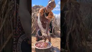Today,, Lucky day hadzabe tribe woman cooking their meat food.