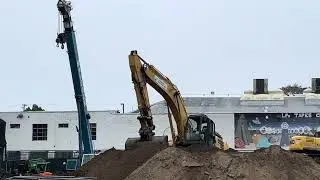 Kobelco Excavators Digging Dirt Along with a Crane on a Construction Site #constructionequipment