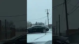 Idiot almost crashes Aston Martin in a snow storm (2022)