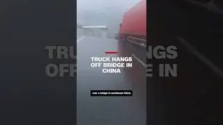 Truck hangs off bridge in China