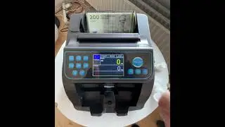 Counting cash 8.600 DKK Danish currency in 200DKK notes