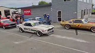 Muscle cars on idle and rolling on track