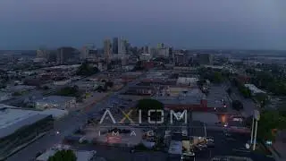 6K drone aerial video fly away from industrial area with view of skyline at twilig.. | DX0001_000979