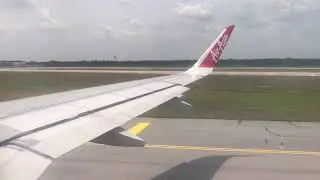 Air asia 9M-AGR  at Kuala Lumpur International Airport take off