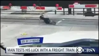 Man Rolls Under Moving Freight Train