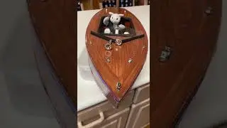 Closeup of Stuart Little animatronics and wooden boat