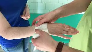 CROSS SHAPED BANDAGE ON THE HAND 4K