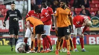 OUCH! Referee Keith Hill gets knocked over by Simon Makienok