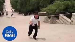 Fitness fanatic trains himself to run down the stairs backwards
