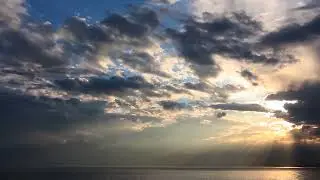 Sunset Behind the Mountains &middot; Dramatic Clouds Over the Sea