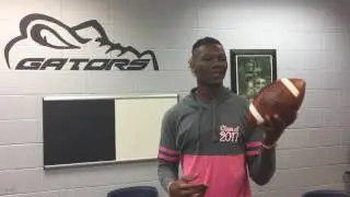 Iowa recruit Brandon Smith tosses a ball in the air